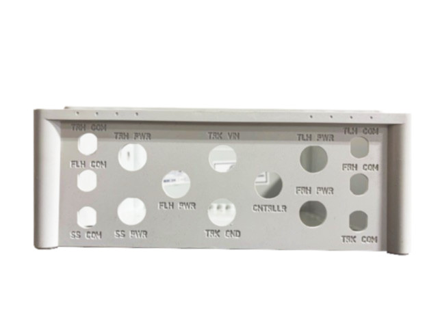 CNC engraved labeling on the side of a Fibox industrial polycarbonate enclosure for permanent equipment identification and custom enclosure marking